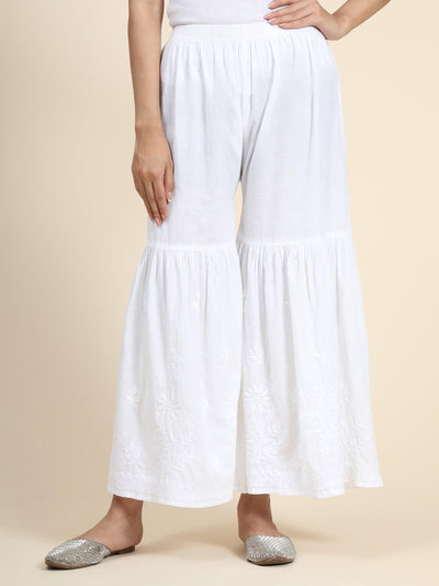 View an elegant white Chikankari Garara. Pure cotton rayon, comfortable ethnic bottom wear for women.