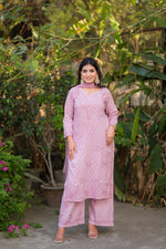 Full shot of a model in a pyazi pink Alfiya Mul Mul Self Set, breathable cotton with Chikankari.