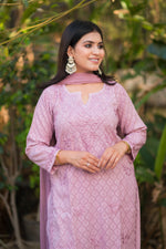 Angled view of a pyazi pink Alfiya Mul Mul Self Set, a stylish ethnic outfit with Chikankari bottom.