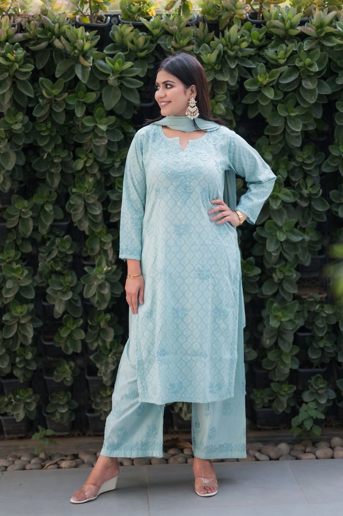 Angled view of an Alfiya Mul Mul Kurti Set, a breathable ethnic outfit with Chikankari bottom embroidery.