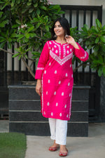 Front view of a floral Chikankari pink kurta for women in soft cotton with side slits. Simple, stylish & comfortable.