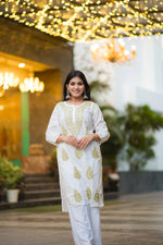 Front view of Snapfab's pristine white Lucknowi Chikankari cotton kurta, intricately embroidered with beige.