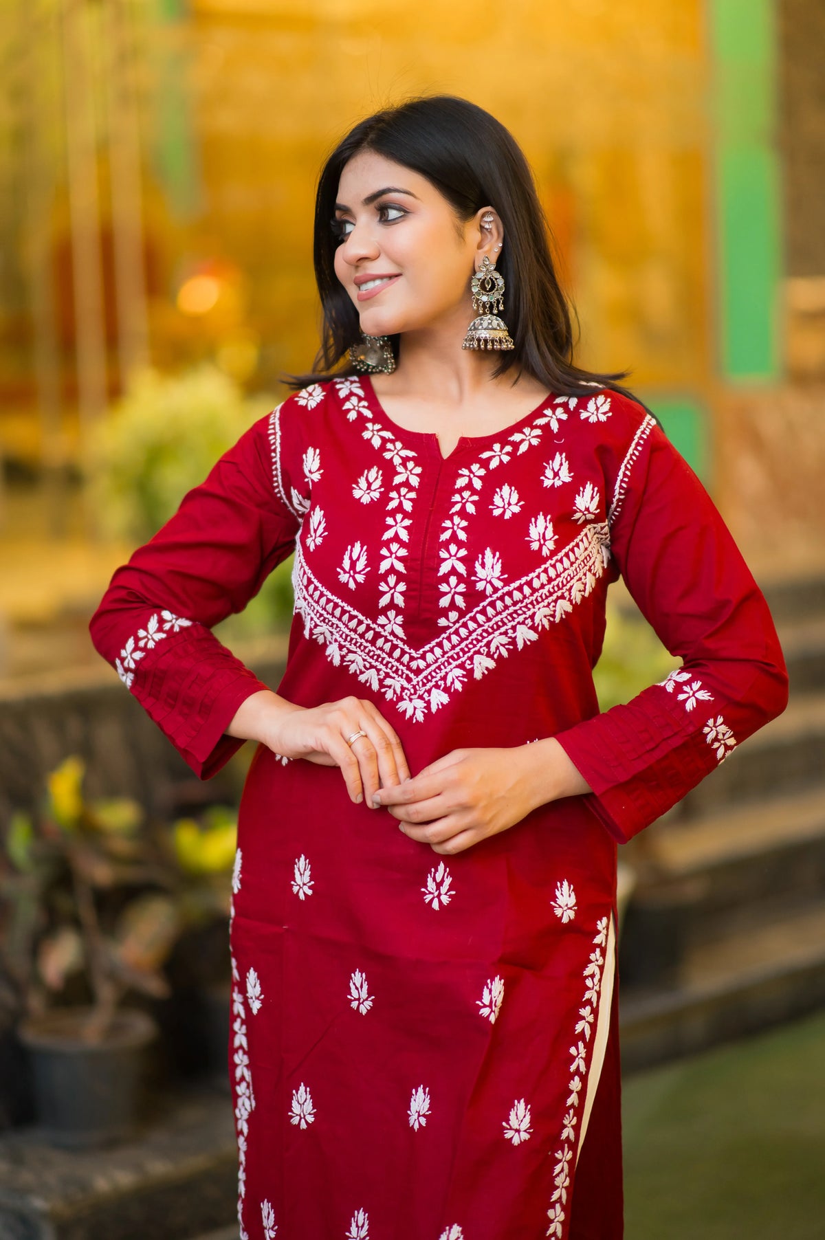 Front view of a model in a comfortable red Riwayat kurti, showcasing its unique ethnic design.