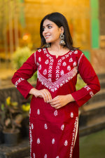 Front view of a model in a comfortable red Riwayat kurti, showcasing its unique ethnic design.