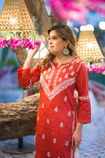 Angled view of a woman in a Riwayat kurti, emphasizing its graceful fabric and ethnic style.