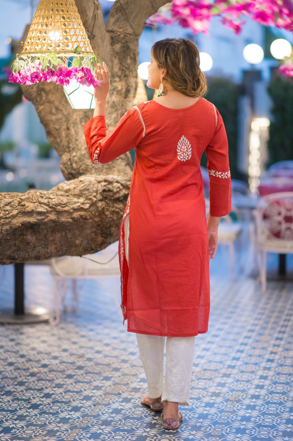 Back view of a woman in a Riwayat kurti and white pants, a popular Indian outfit choice.