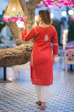 Back view of a woman in a Riwayat kurti and white pants, a popular Indian outfit choice.