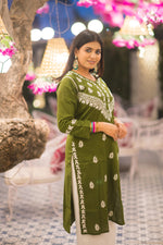 Side angled front view of light green cotton chikankari kurta with delicate embroidery, perfect for summer casual ethnic styling.