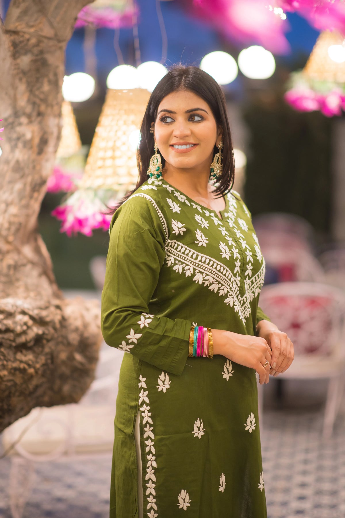 Front angle shot of classic green chikankari kurta, featuring fine hand embroidery for elegant ethnic wear.