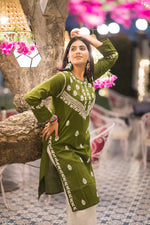 Side angle view of green cotton chikankari kurta with subtle embroidery, great for summer ethnic outfits.
