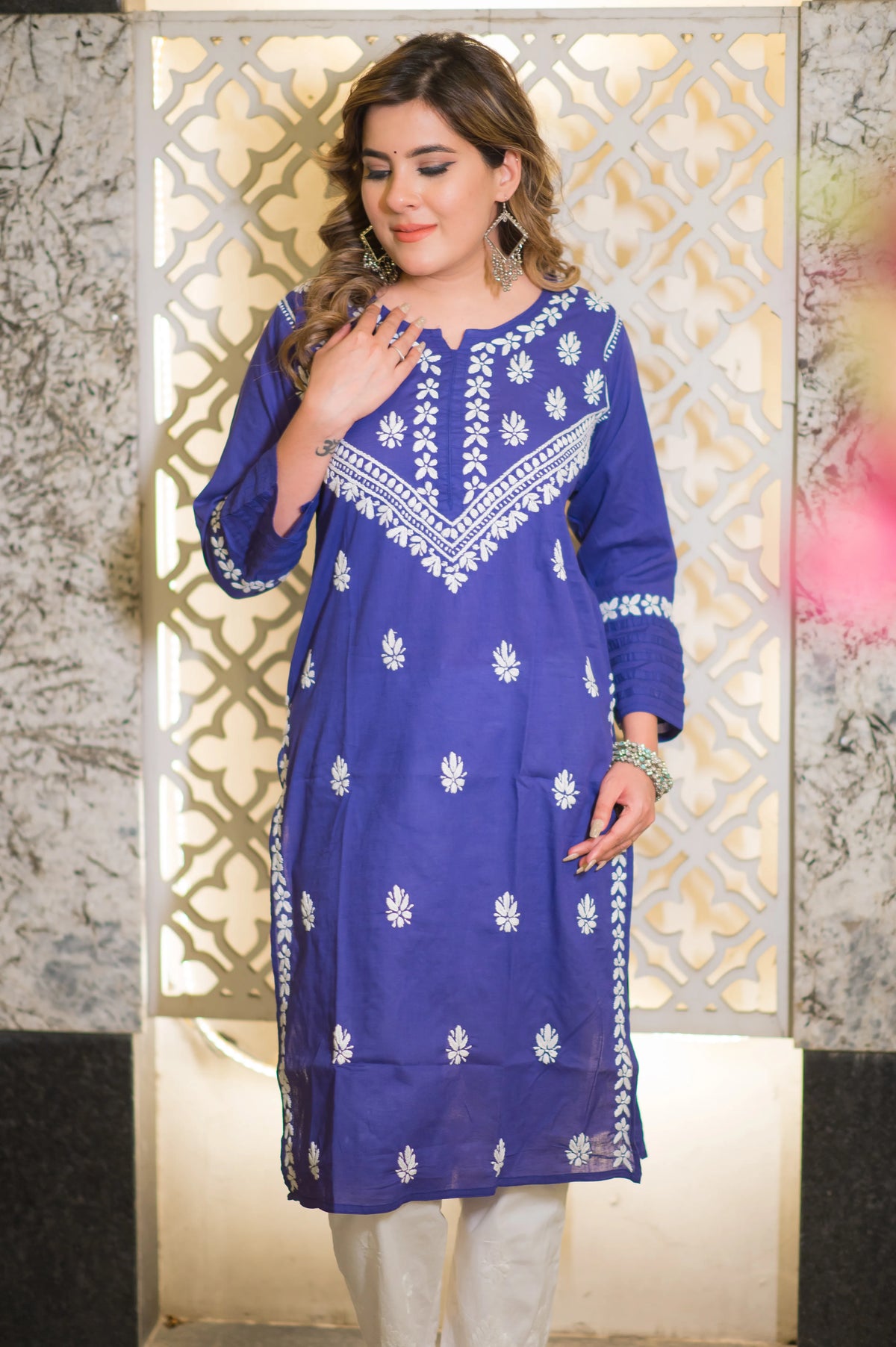 Full shot of a model in a royal blue riwayat kurta featuring white chikankari work.