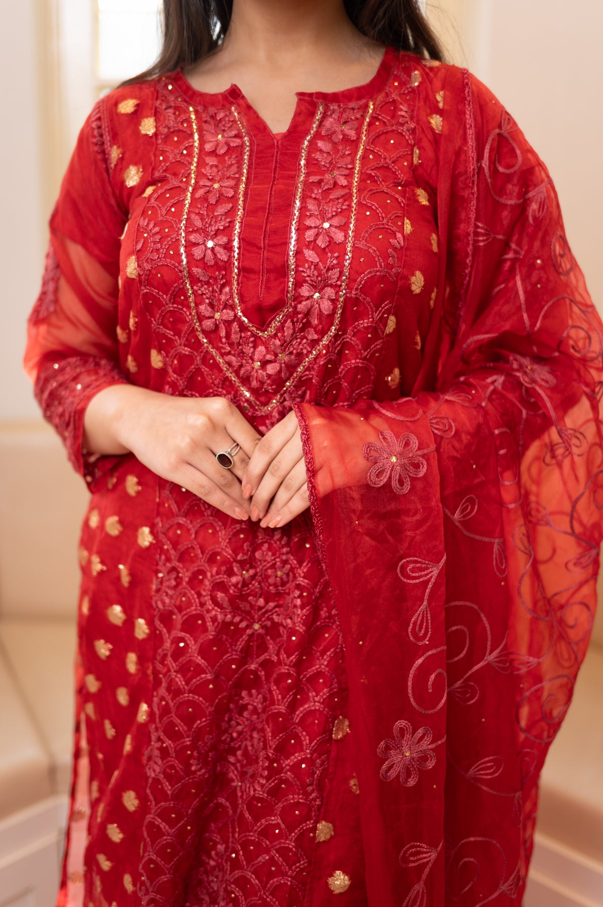 Close-up front Red organza kurta. View intricate embroidery details, trending organza kurti set.