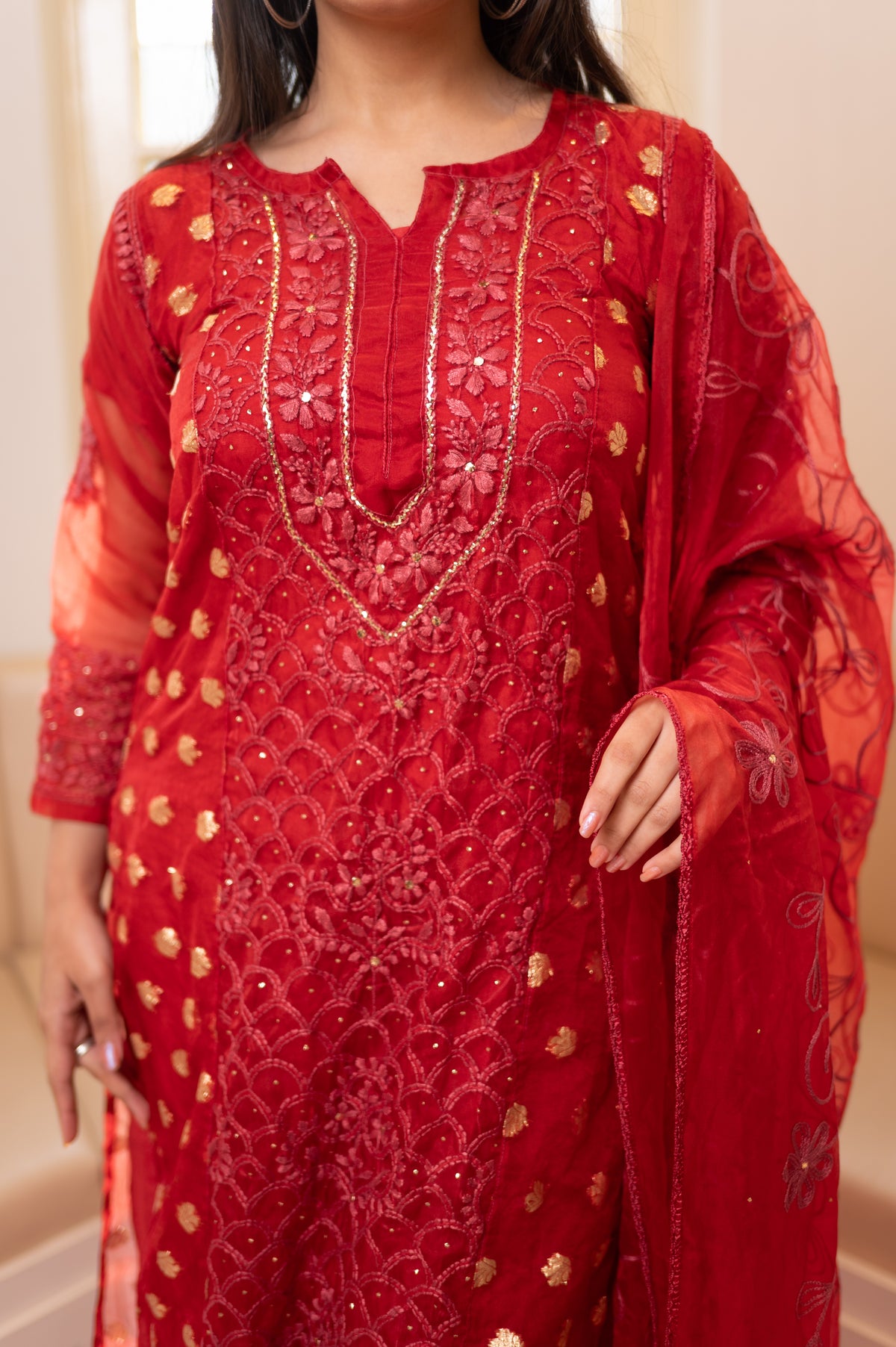 Close-up front red Organza kurta. View detailed embroidery, stunning organza material for ethnic fashion.