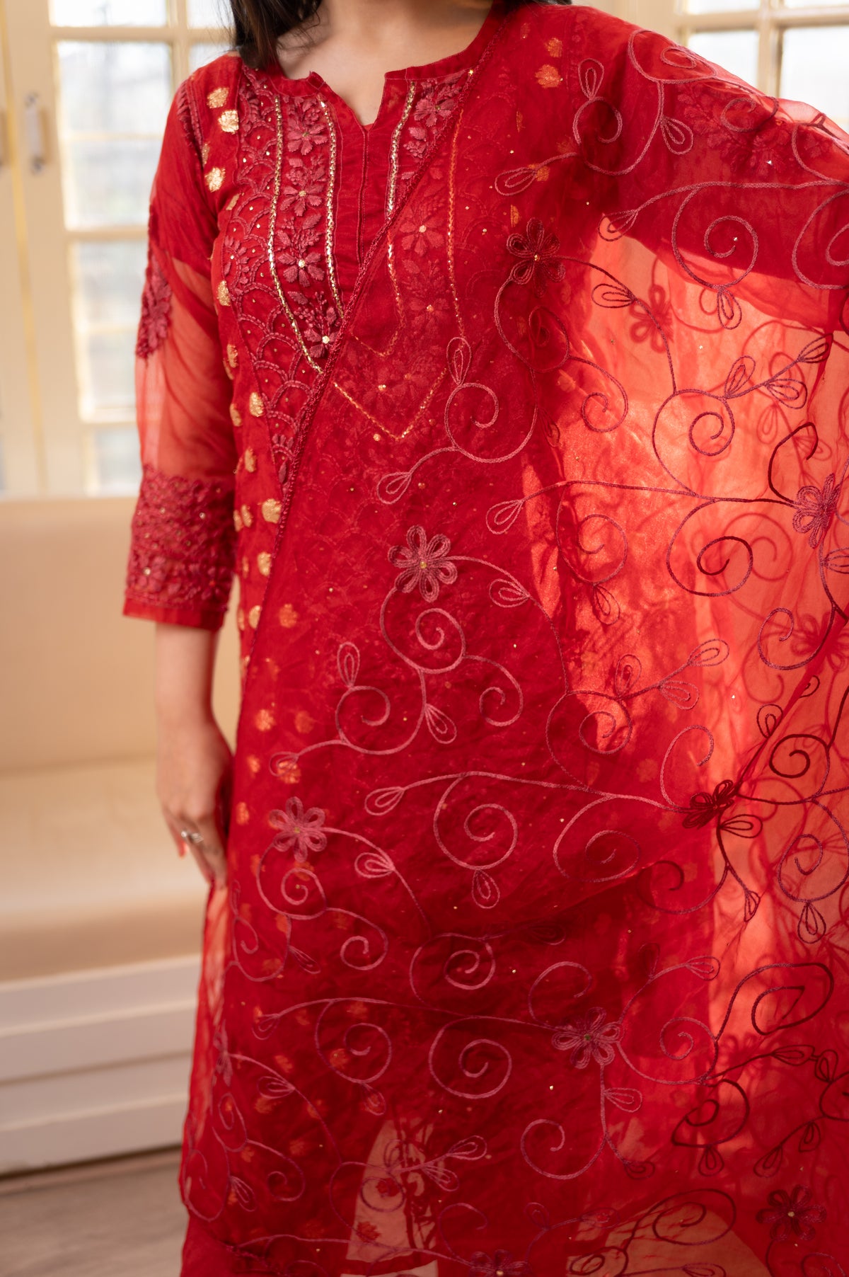 Close-up front Organza red Lucknow Chikan kurti. View elegant design, perfect for an organza kurta set, trending.