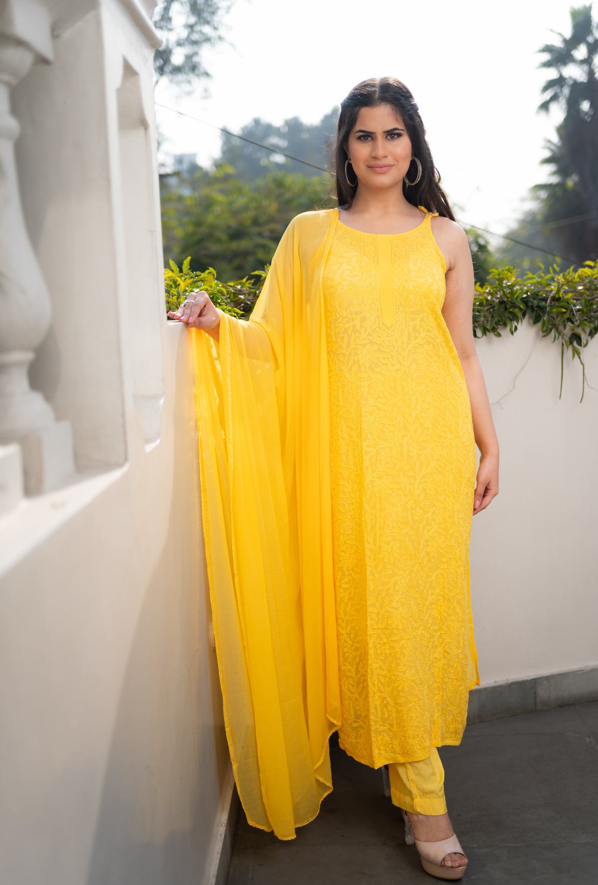 A bright Yellow Viscose Sleeveless Kurti, 46 inches long. Made from pure viscose fabric, perfect for summer.