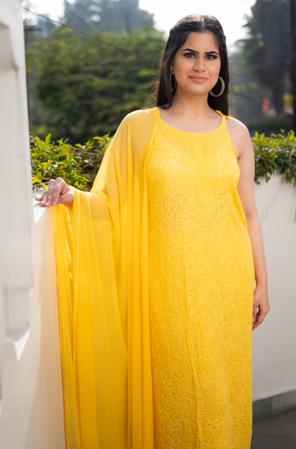 View a bright Yellow Viscose Sleeveless Kurti. Features beautiful pure Chikankari handwork on georgette.