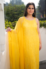 View a bright Yellow Viscose Sleeveless Kurti. Features beautiful pure Chikankari handwork on georgette.