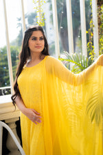 View the breathable georgette fabric of a Yellow Viscose Sleeveless Kurti with delicate Chikankari.