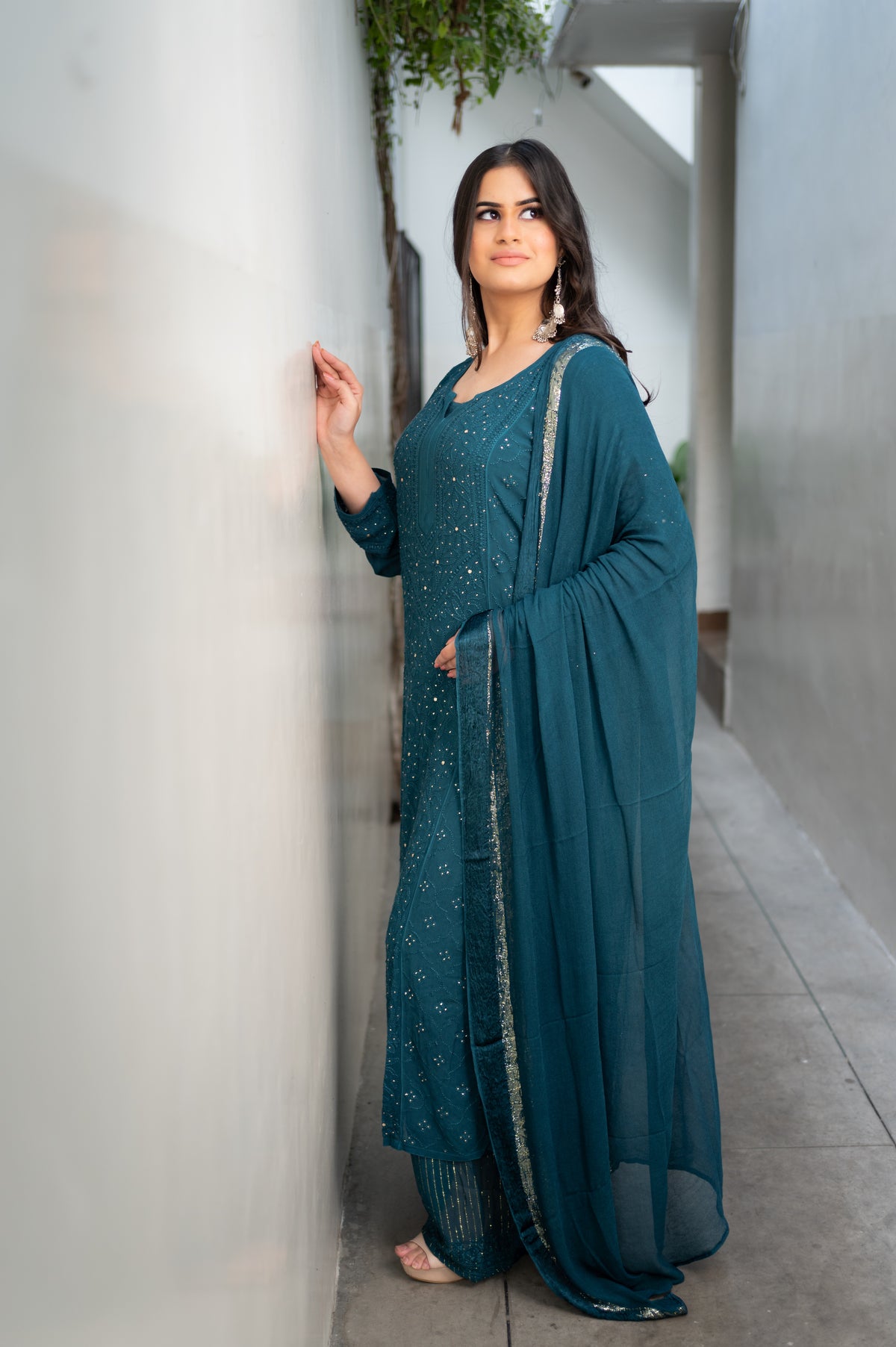 Close-up of fine Chikankari and glistening Mukaish handwork on a Blue viscose georgette kurti.