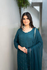 Intricate Chikankari motifs with Bhakiya and Phanda on a Blue viscose georgette kurti, Mukaish embellished.