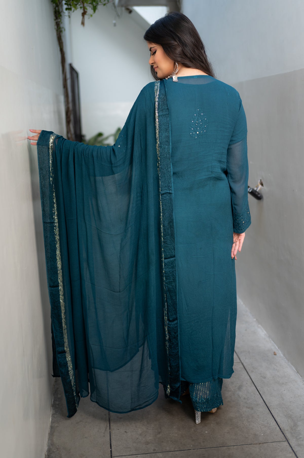 Glistening Mukaish hand work and Chikankari on a Blue georgette fabric Viscose Set. Uses viscose thread.