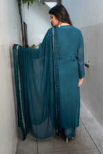 Glistening Mukaish hand work and Chikankari on a Blue georgette fabric Viscose Set. Uses viscose thread.