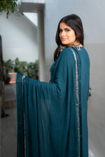 Close-up of detailed Chikankari handwork and Mukaish on a Blue pure viscose georgette fabric.