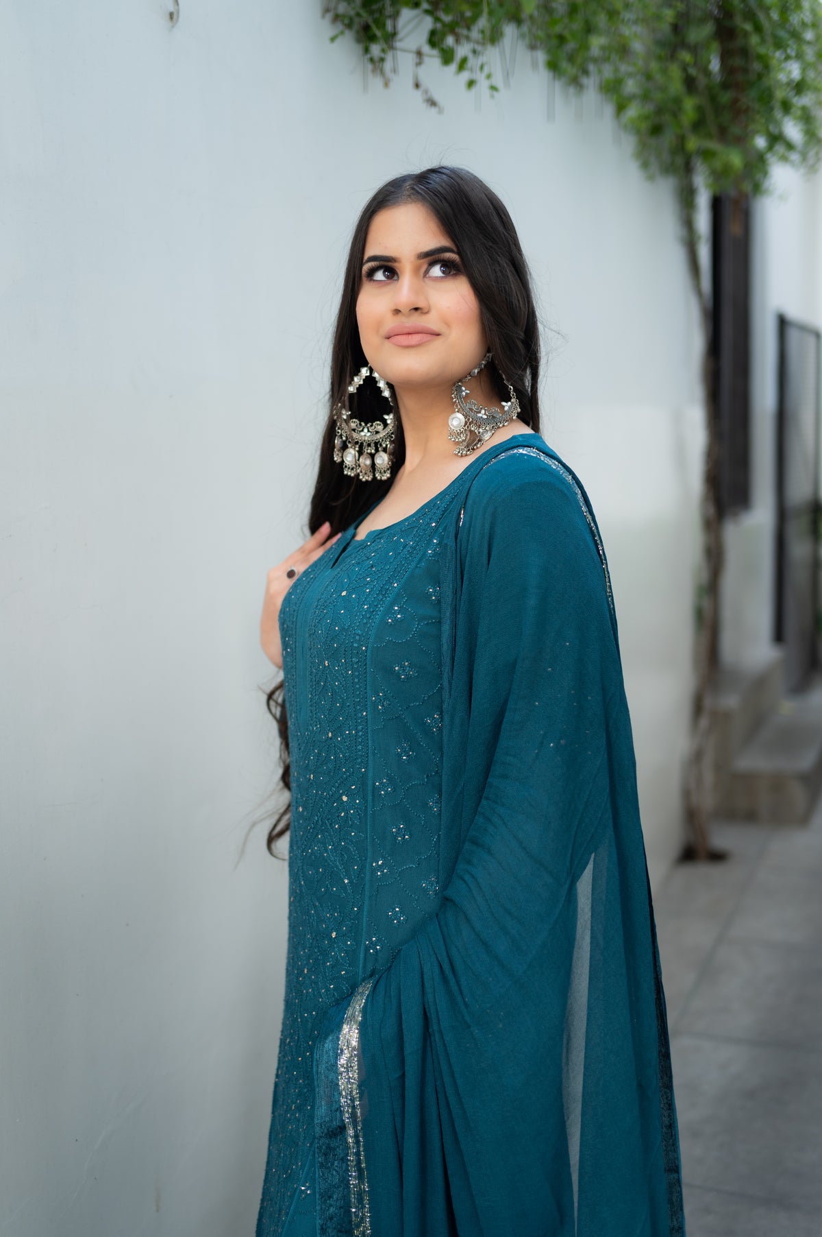 A stunning Blue Viscose Set. This georgette kurta set is an art piece with hand-made Chikankari and Mukaish.