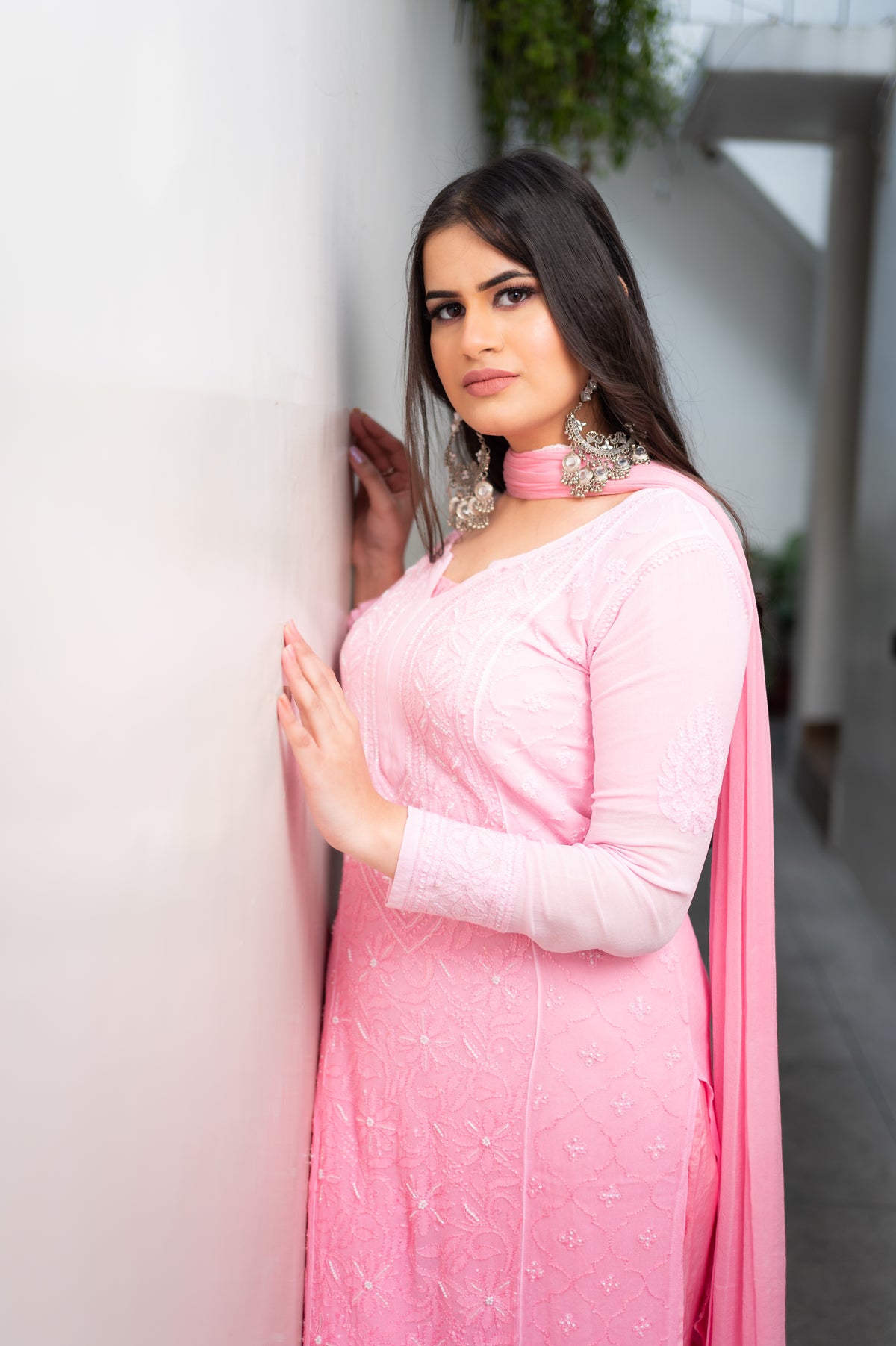 Close-up of fine Chikankari and glistening Mukaish handwork on a Pink viscose georgette kurti.