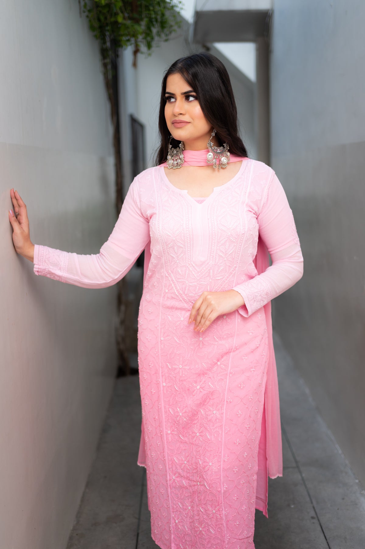 View an elegant Pink Viscose Set, a georgette kurta set with Chikankari and Mukaish handwork.