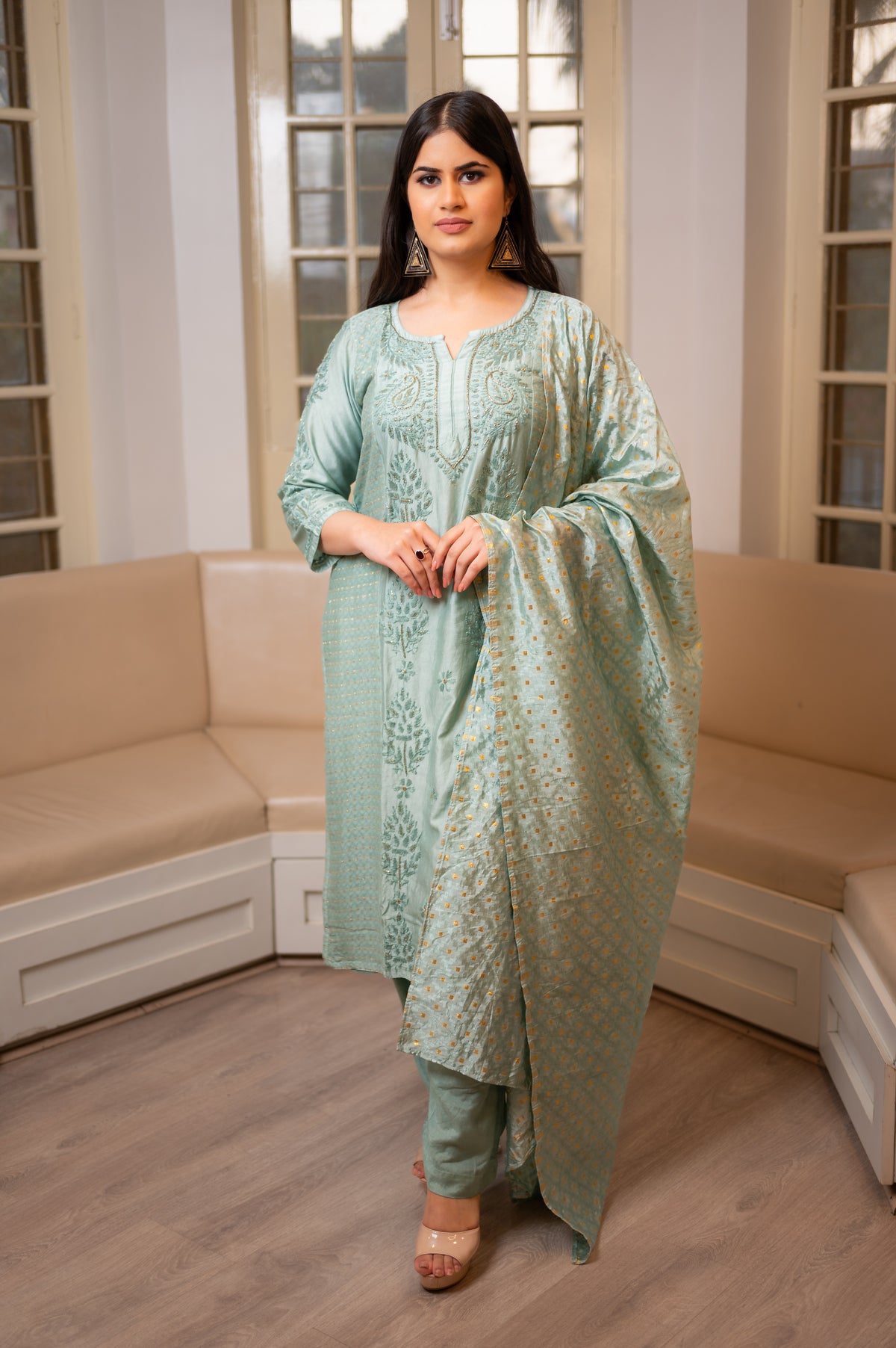 A Green Muslin Chanderi Kurti Set designed for elegance, with Chikankari and Zari work.