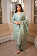 A Green Muslin Chanderi Kurti Set designed for elegance, with Chikankari and Zari work.