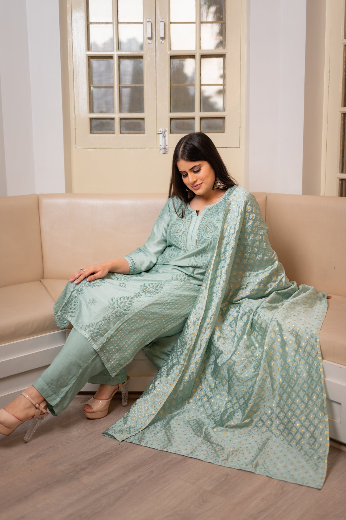View a stunning Green Muslin Chanderi kurta set, featuring elegant Chikankari and Zari work.