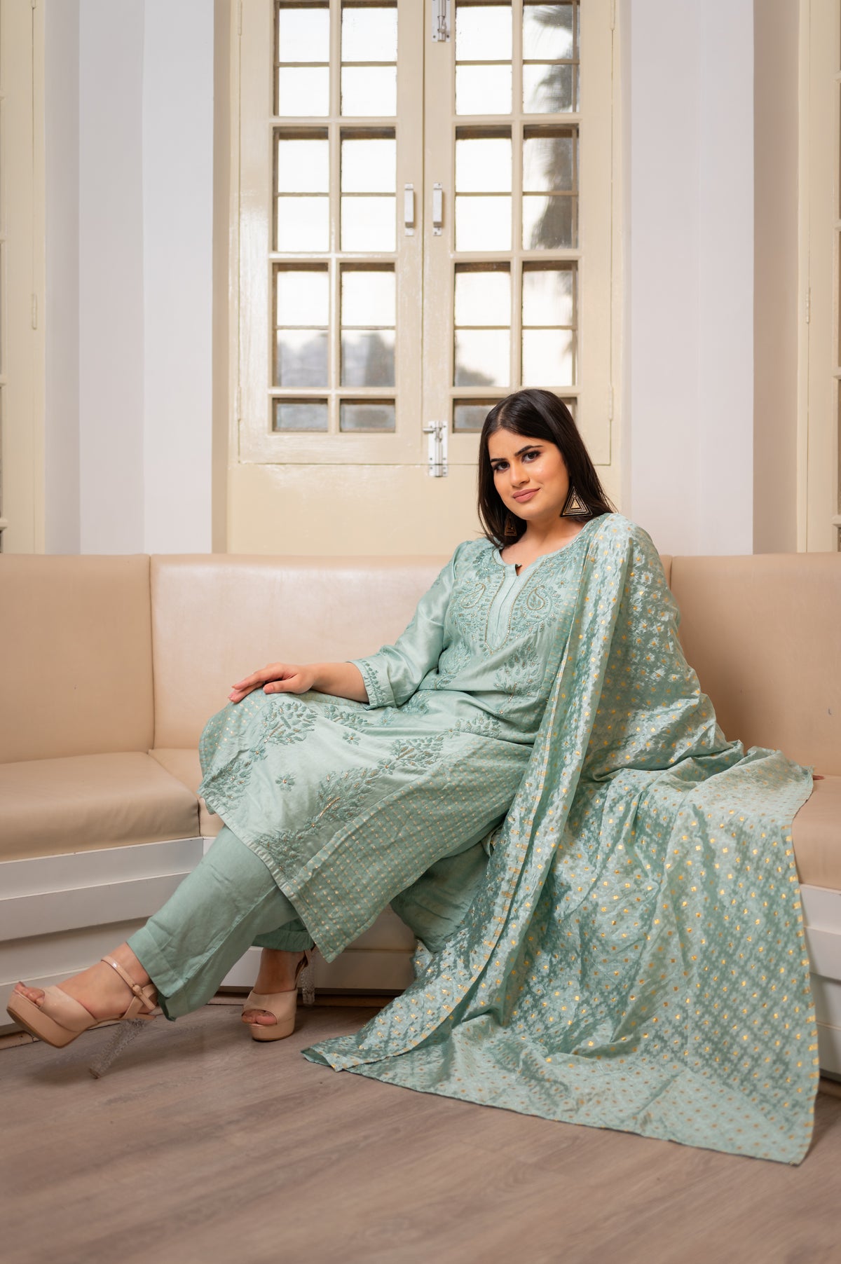 Close-up of Chikankari handwork and Zari Cut Dana on a Green chanderi fabric kurti set.