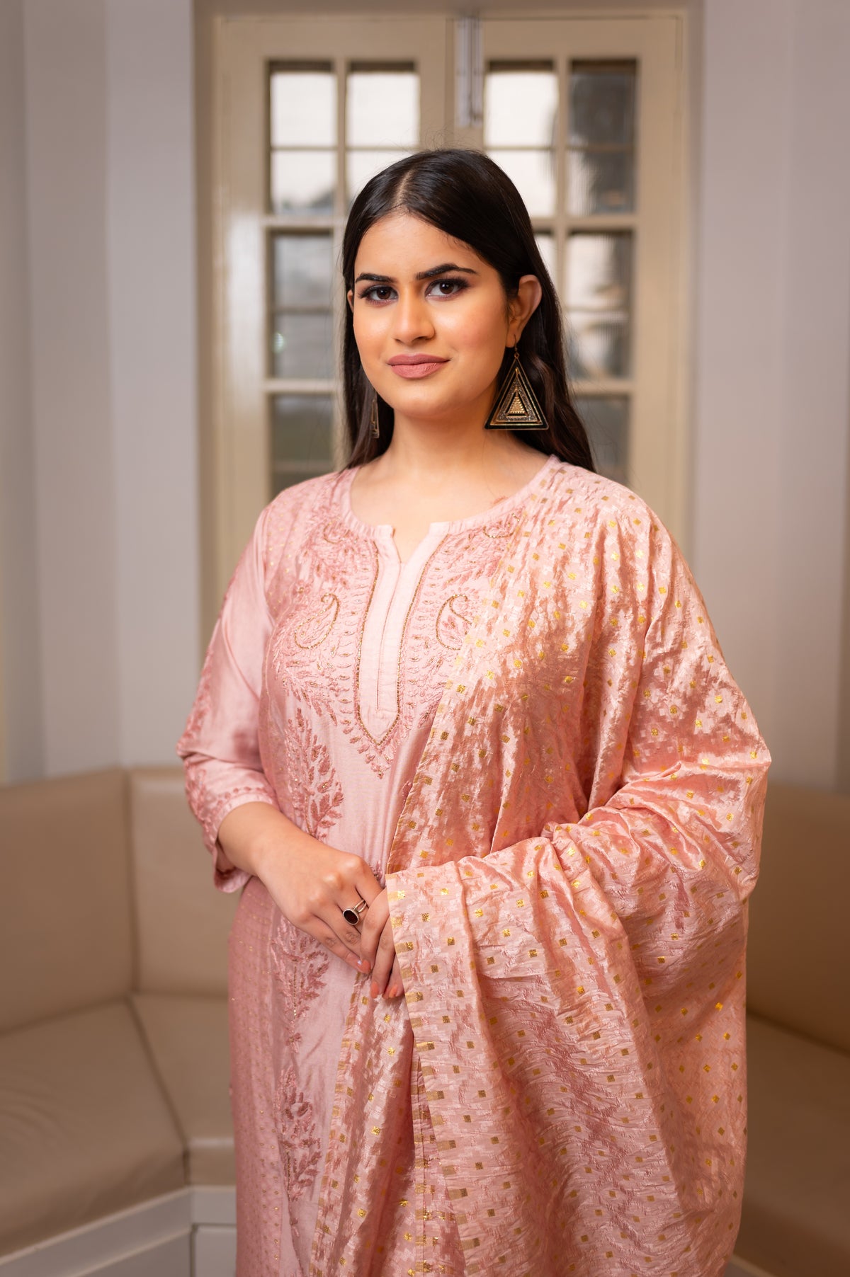 Close-up of intricate Chikankari and shimmering Zari Cut Dana on a Pink chanderi kurti.