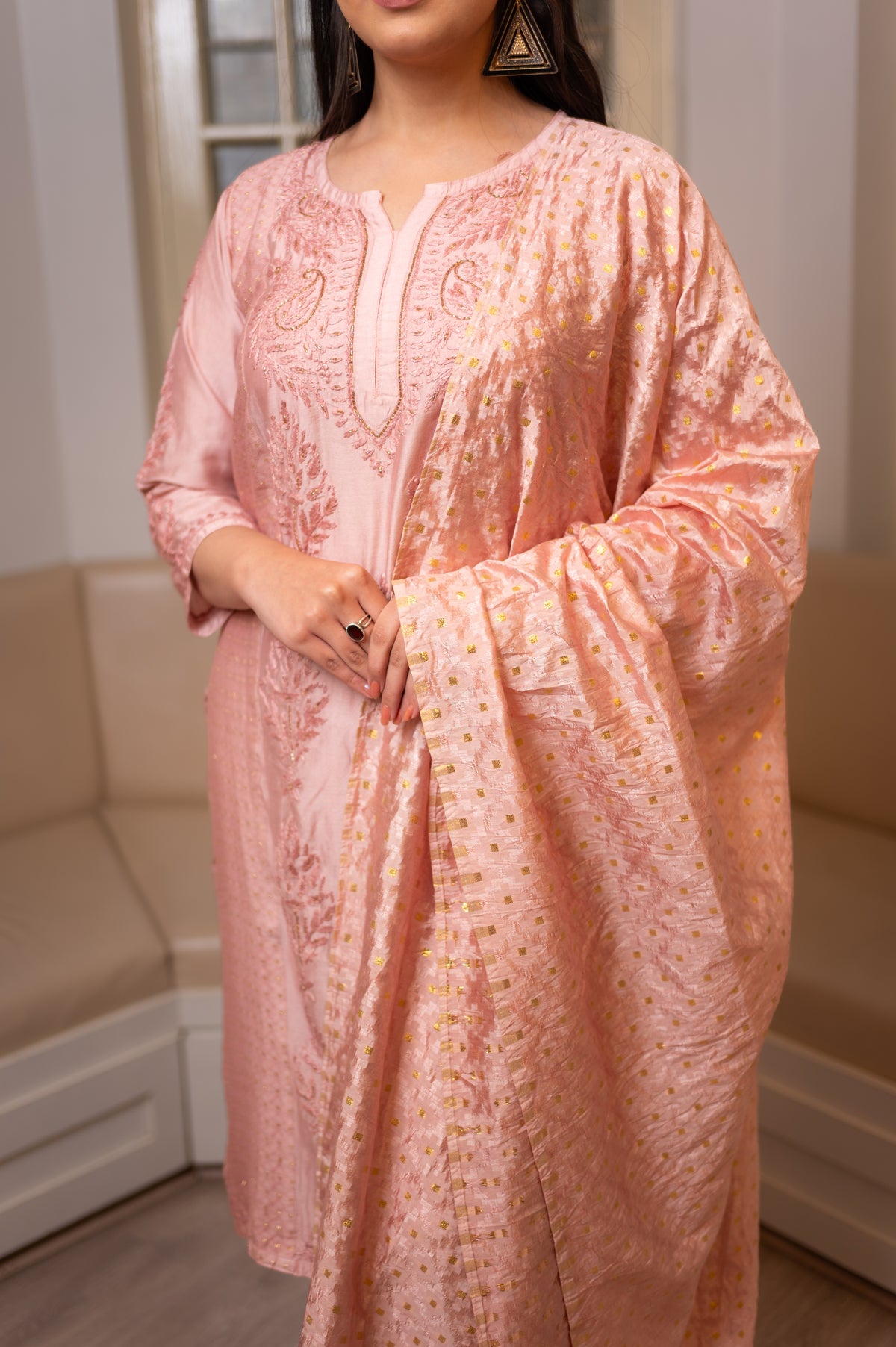 An elegant Pink chanderi kurta set, showcasing beautiful drape and detailed Chikankari work.