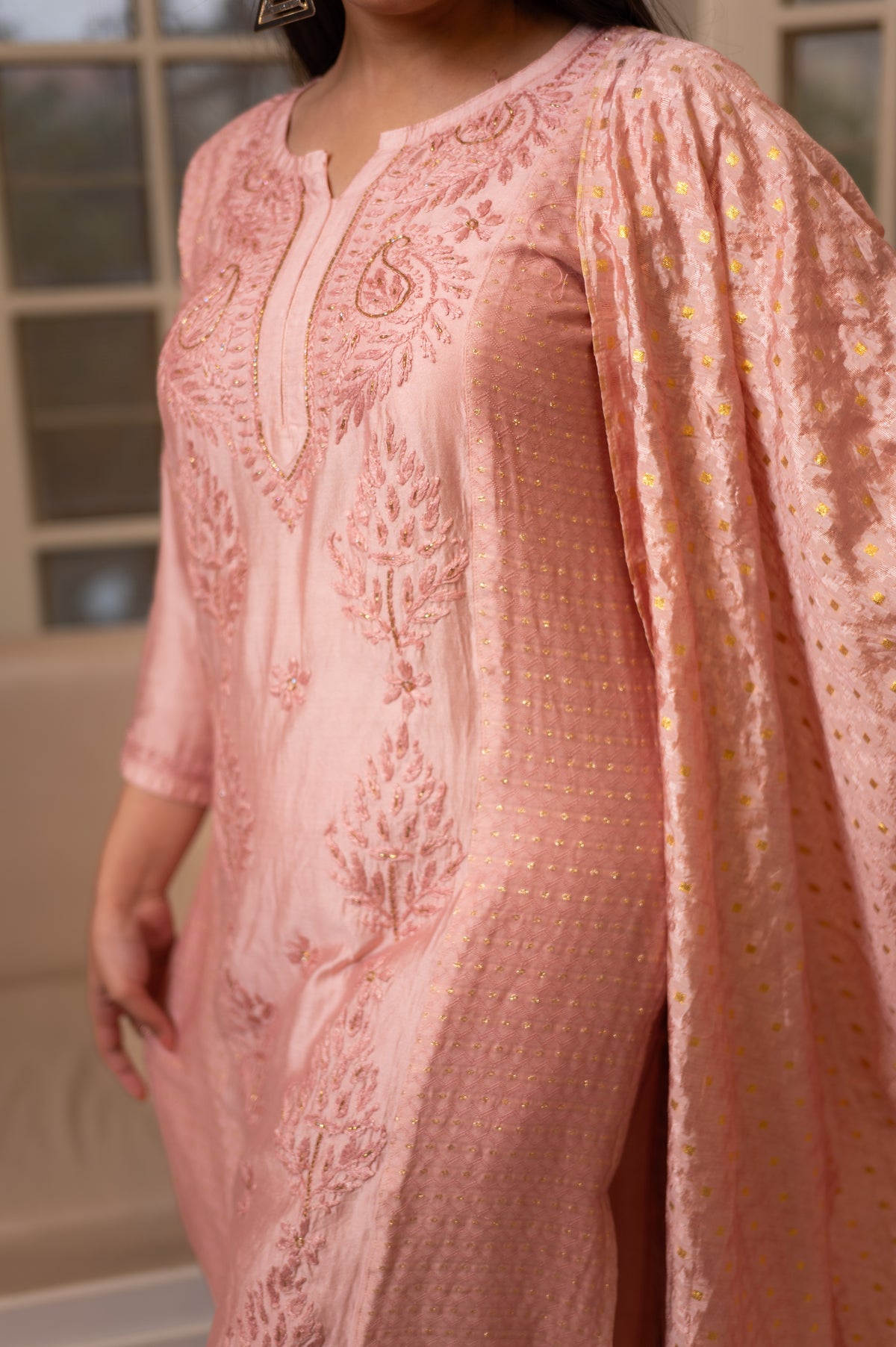 This Pink chanderi kurta set drapes beautifully, its chanderi fabric a testament to elegance.
