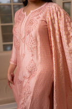 This Pink chanderi kurta set drapes beautifully, its chanderi fabric a testament to elegance.