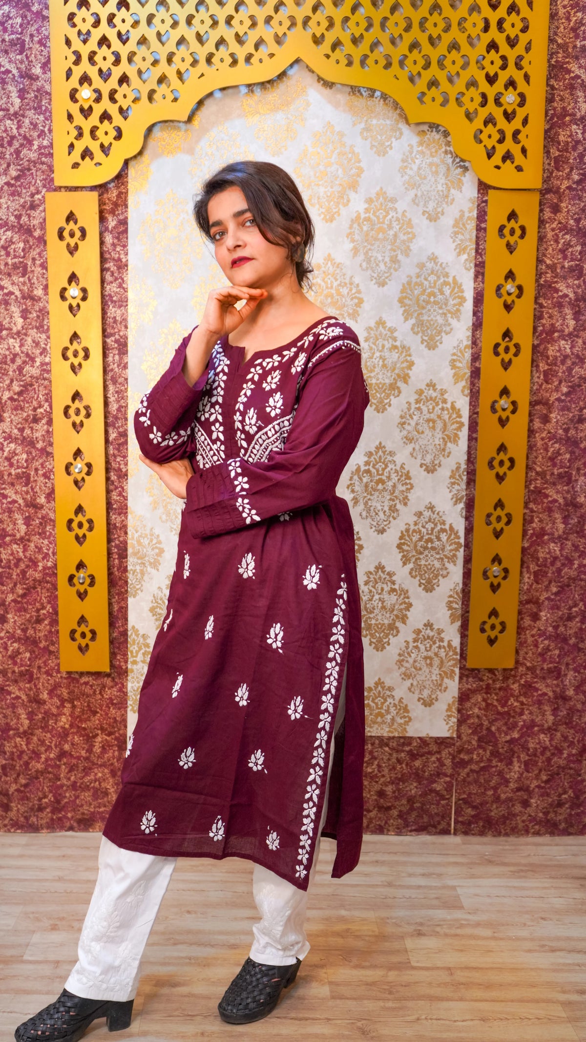 Side view of a wine Chikankari kurti, a skin-friendly traditional Indian tunic for women.