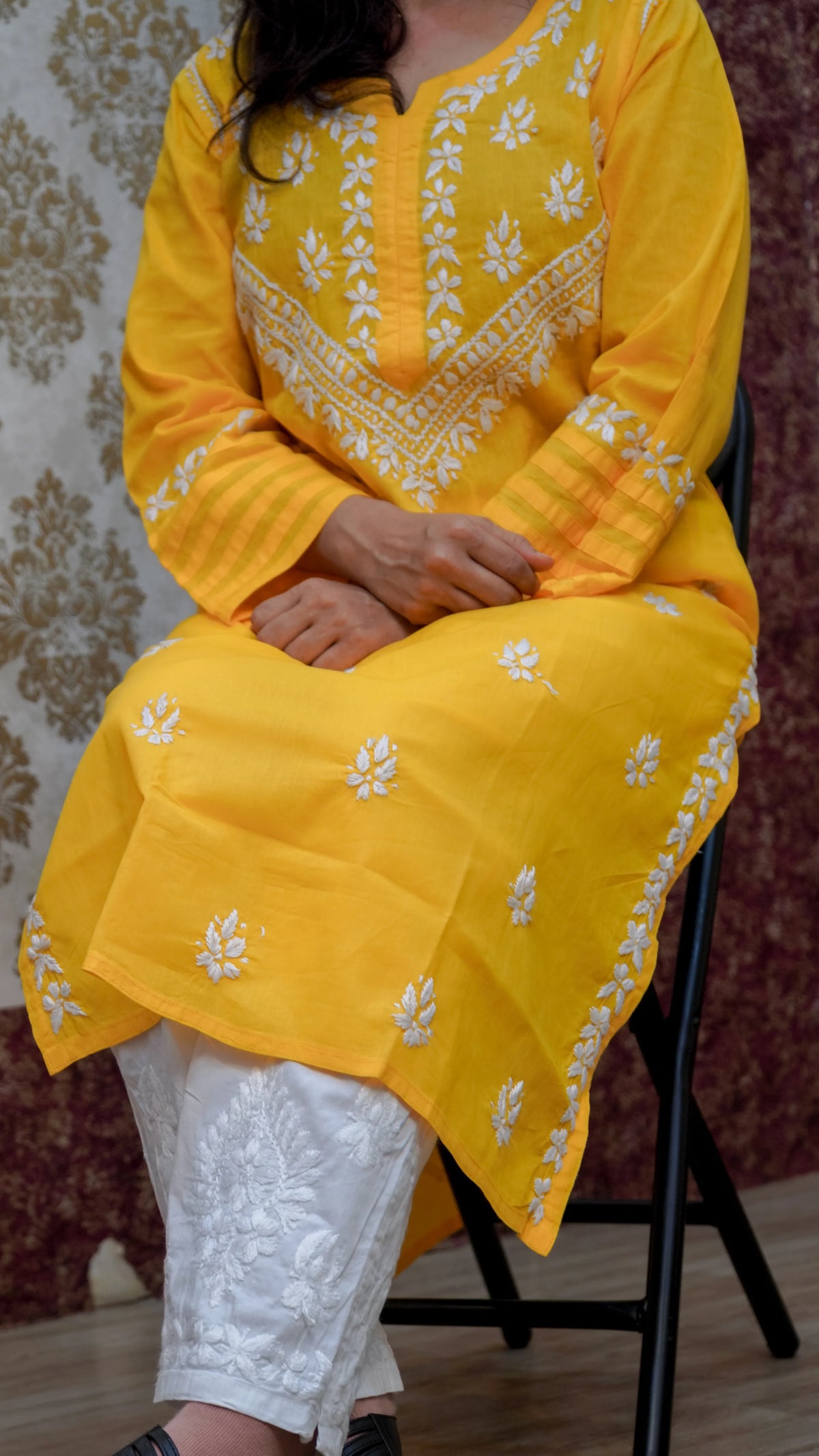 Vibrant yellow Chikankari kurti, featuring intricate white thread embroidery, designed for comfortable everyday wear.