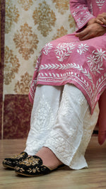 View of Pink chikankari kurti made with viscose rayon and fine white embroidery, elegant ethnic styling with pant.
