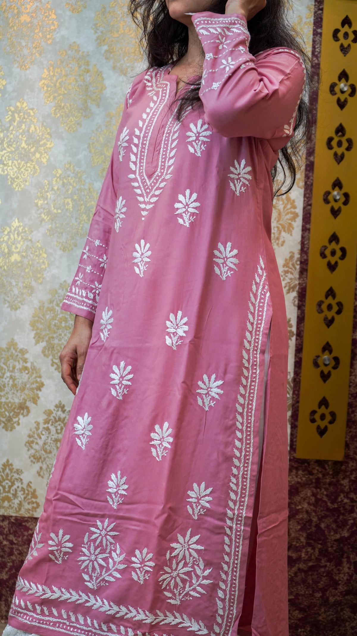 Front view of pink viscose rayon kurti with white chikankari embroidery, perfect for ethnic wear or casual occasions.