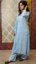 Angled view of a sky blue Modal Satin kurti, a trending ethnic piece with Chikankari accents.