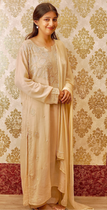 Detailed hand embroidery with pearls and cut-dana on a camel viscose georgette kurti. Unique Chikankari.