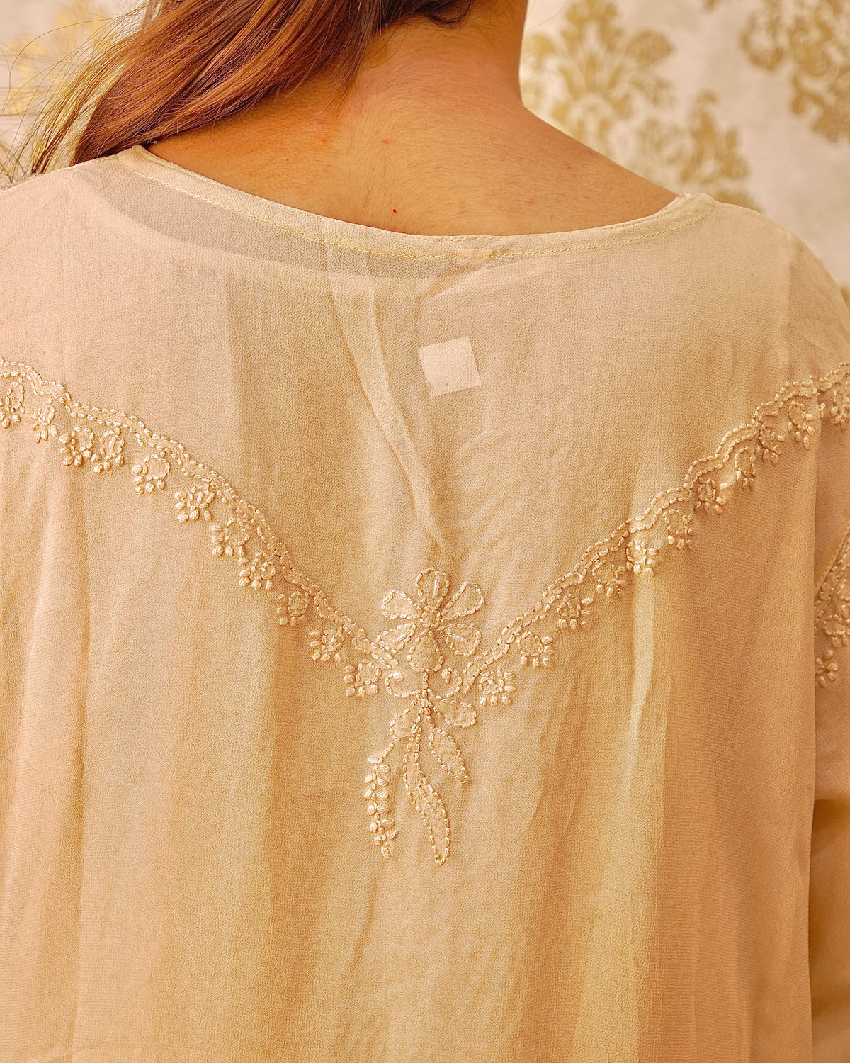 View a complete camel Viscose Pearl Chikankari Kurta Set. Includes kurti, pant, and dupatta for ethnic wear.