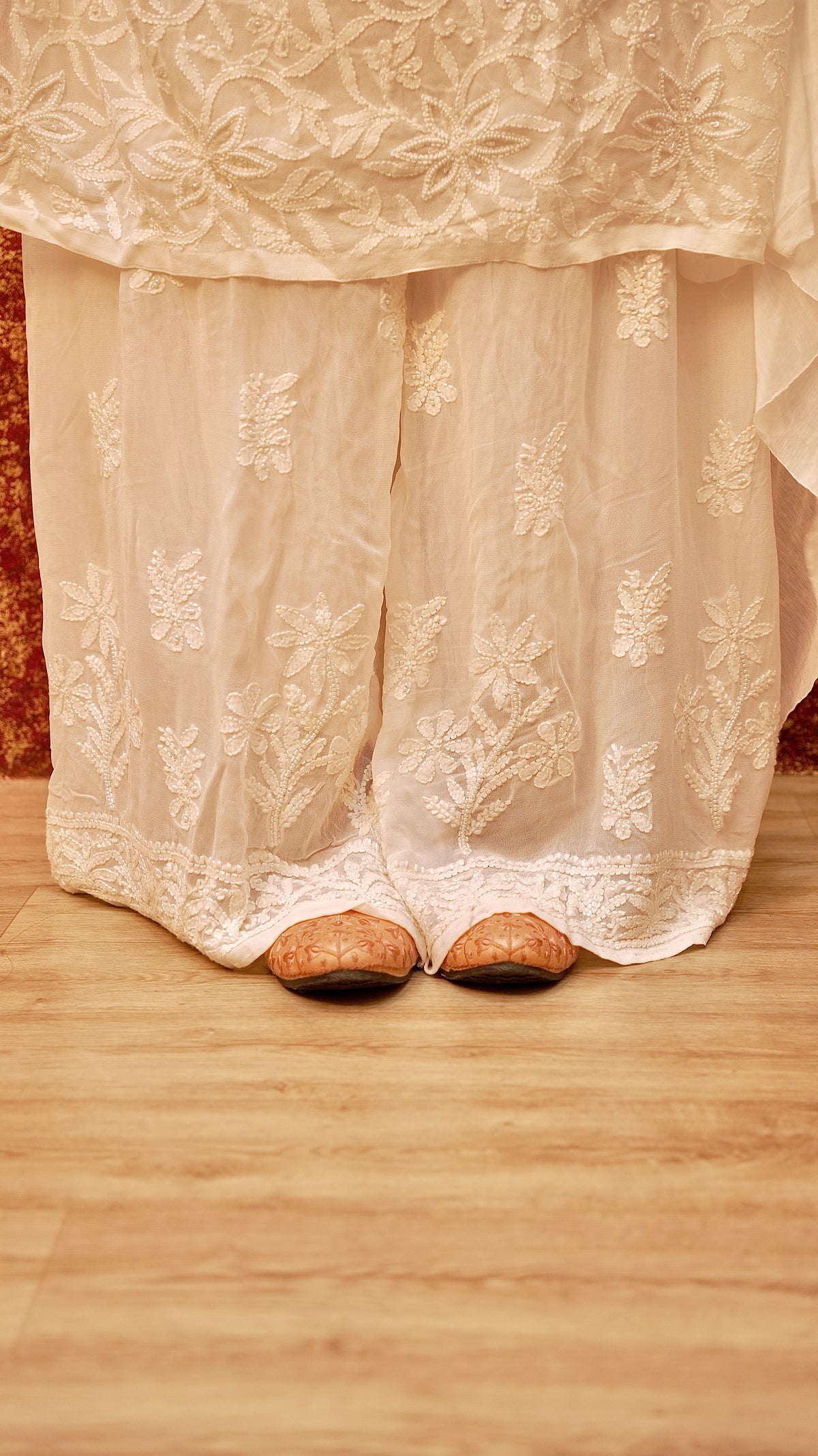 View intricate Chikankari embroidery on a viscose georgette palazzo. Perfect ethnic bottom wear for women.