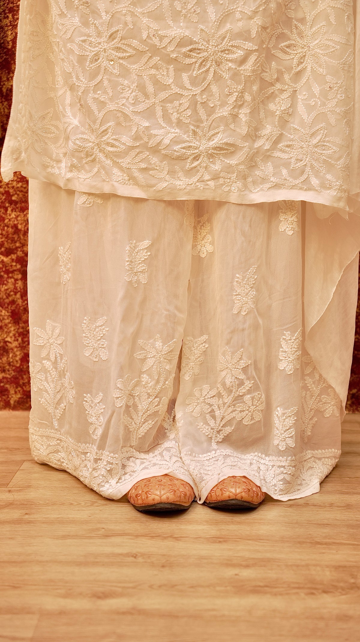 Front view of an elegantly embroidered Chikankari palazzo in viscose georgette. A graceful ethnic bottom wear.