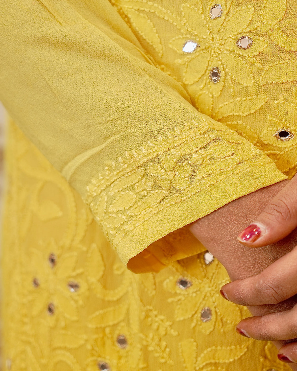 View an elegant white Viscose Mirror Work Kurta Set. Features shimmering Chikankari and real mirror work.