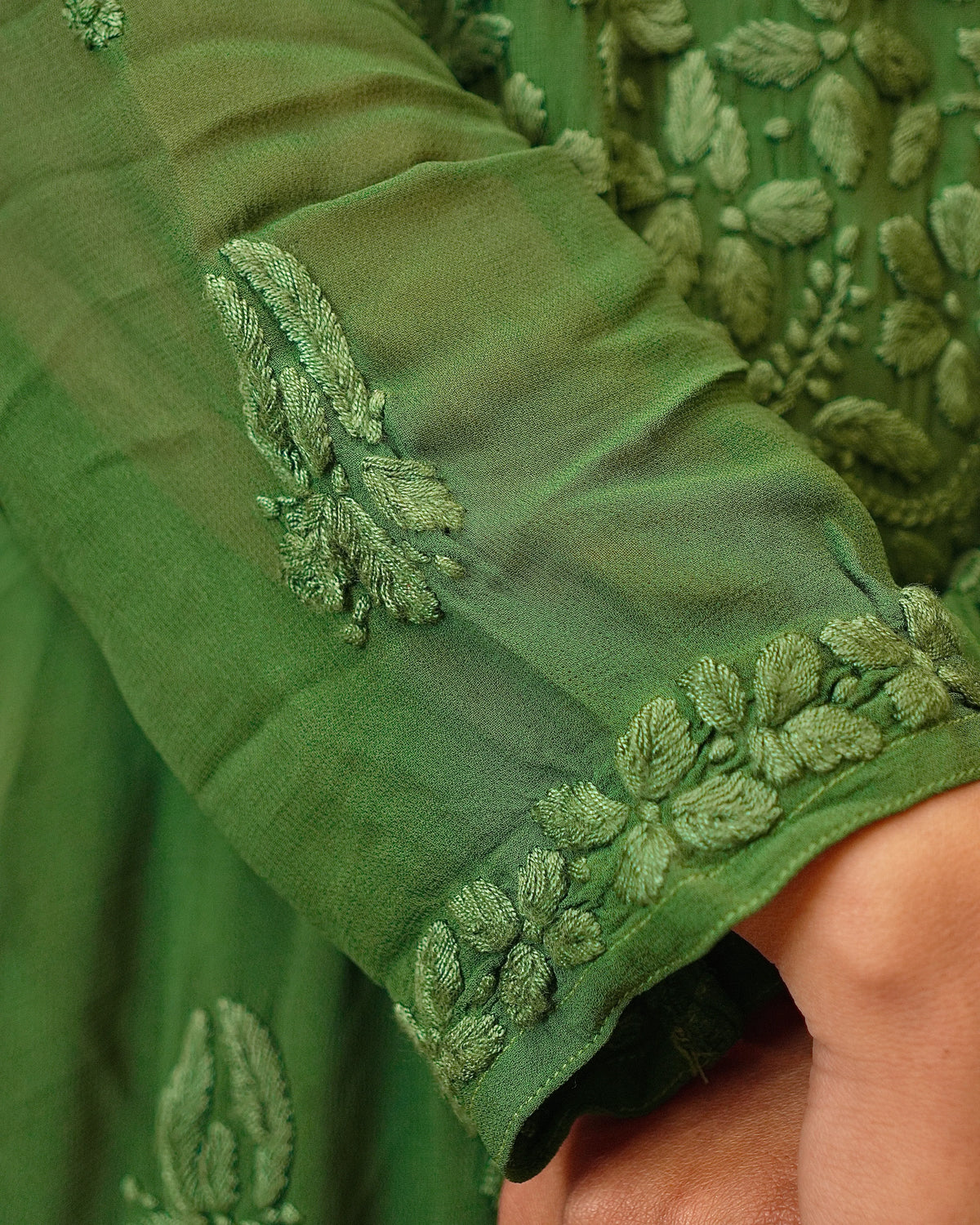 View the pure viscose georgette fabric of a green 3D Kurti Set. Breathable and comfortable.