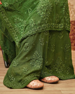 Close-up of 3D Chikankari hand embroidery on the pant of a green Viscose Kurti Set.